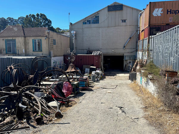 951A Hudson Avenue yard and building entrance