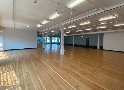 1543 Mission Street open floor with hardwood floors and large windows
