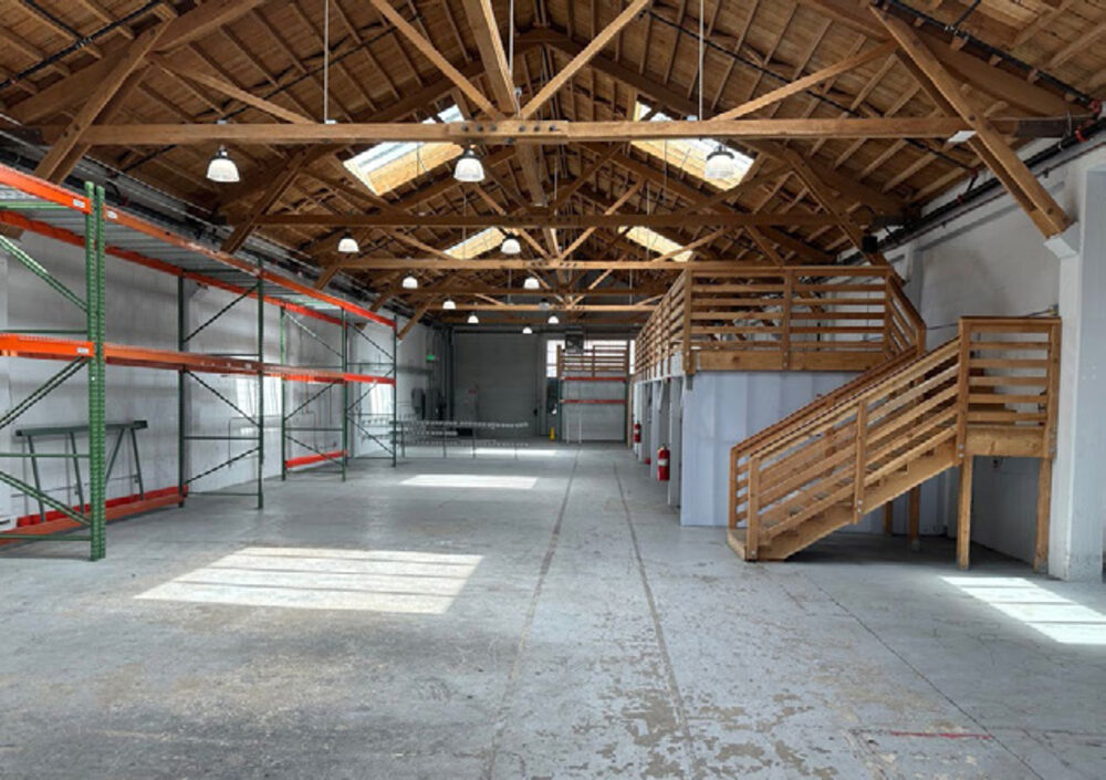 1251-1255 Howard Street interior with mezzanine stairs
