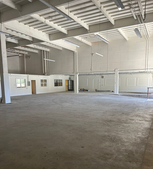 2398 Jerrold Avenue warehouse interior with white trusses