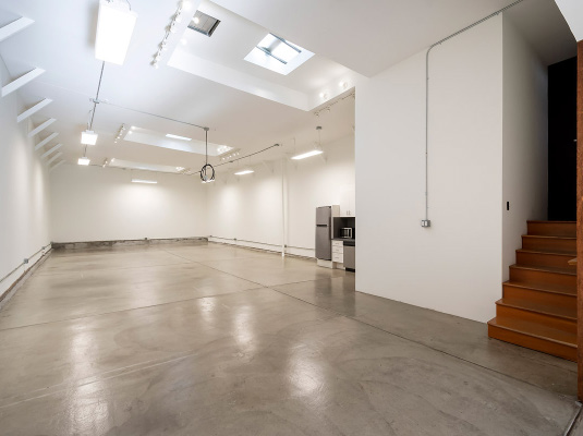 450 Clementina Street open space with skylights and kitchenette